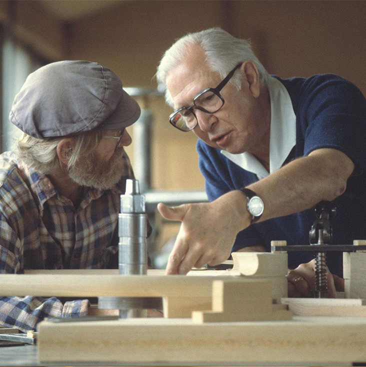 hans-j-wegner-and-henry-fisker-the-woodcutting-machinist-discussing-the-arm-of-pp52.jpg